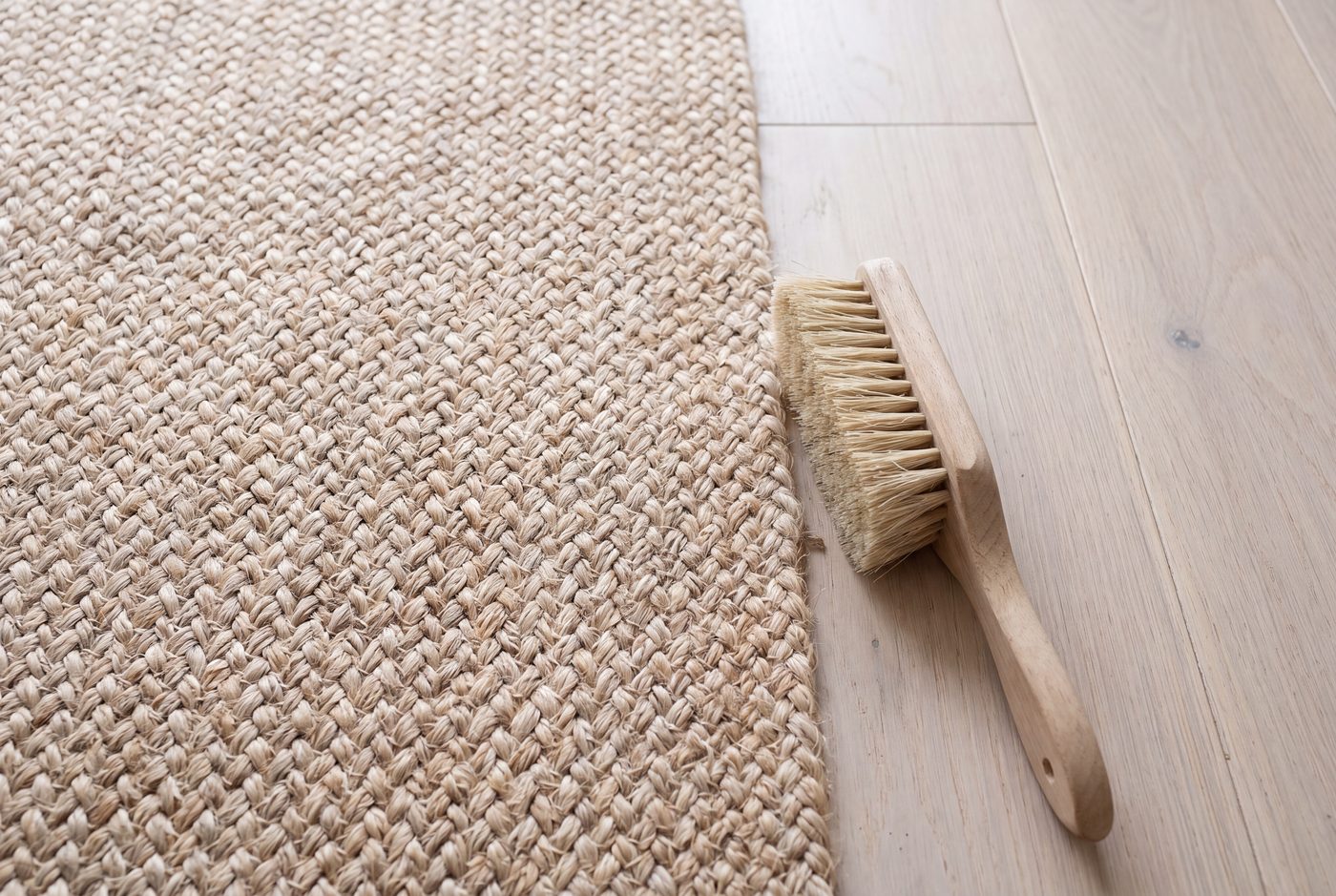 Close up of the coarse braided weave of a natural jute rug